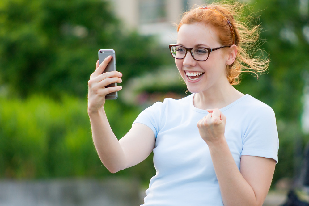 Teenage girl excited A level results day UCAS Clearing The Parents' Guide to