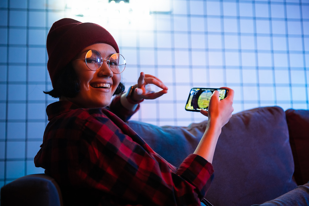Teenage girl mobile phone looking at camera engaging senses: The Parents' Guide to