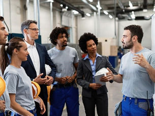 A construction manager talking to his team
