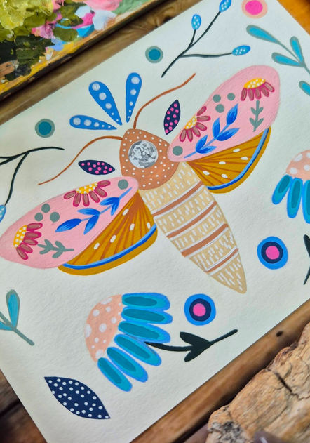 A folk-style illustration in acrylic featuring a floral moth, surrounded by flowers and botanicals.
