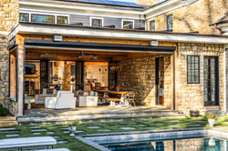 Open outdoor patio with stone facade