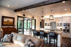 Warm, modern interior living room design with shiplap ceiling