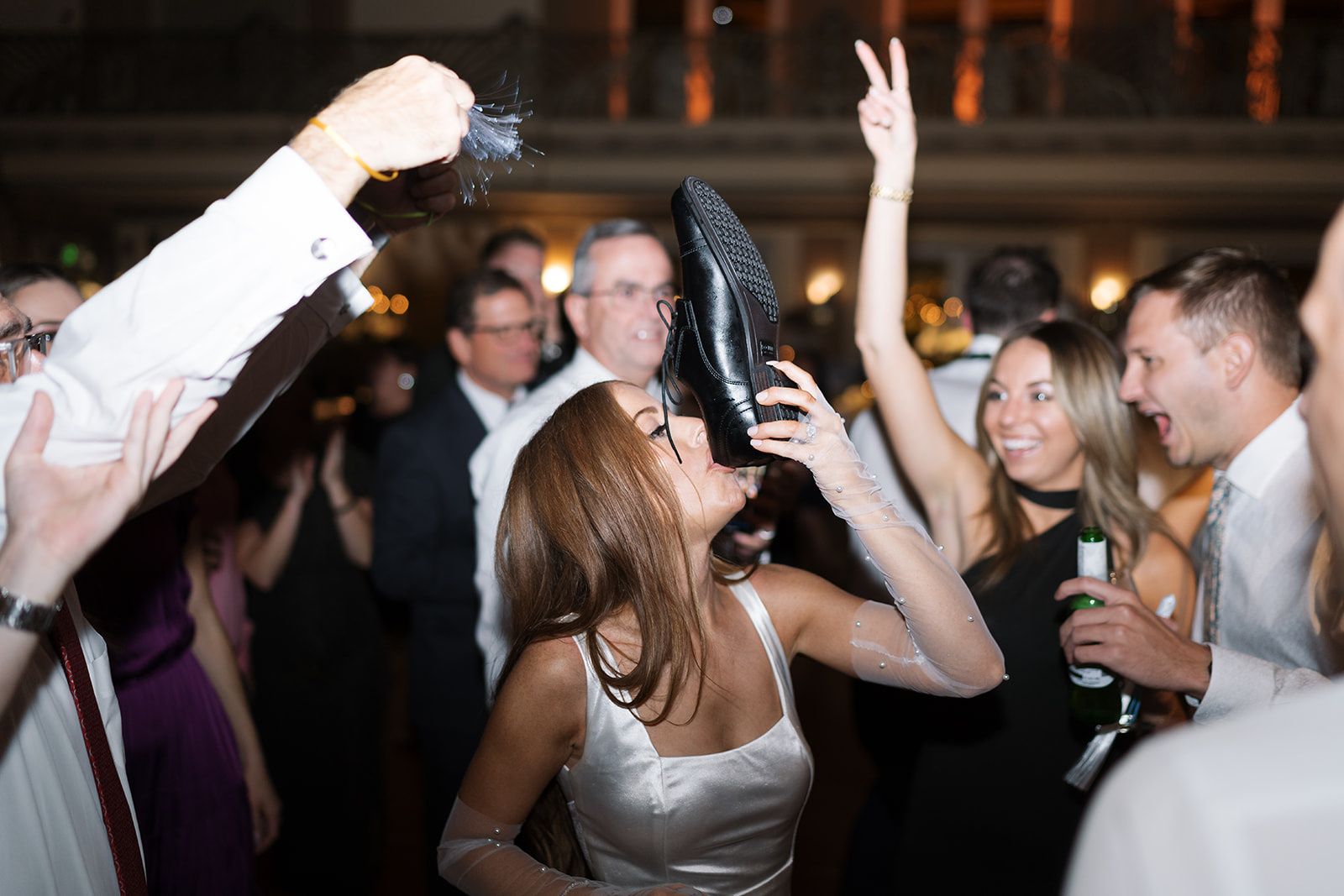 Guests cheering on the dance floor during Dom and Hayley's late-night wedding celebration