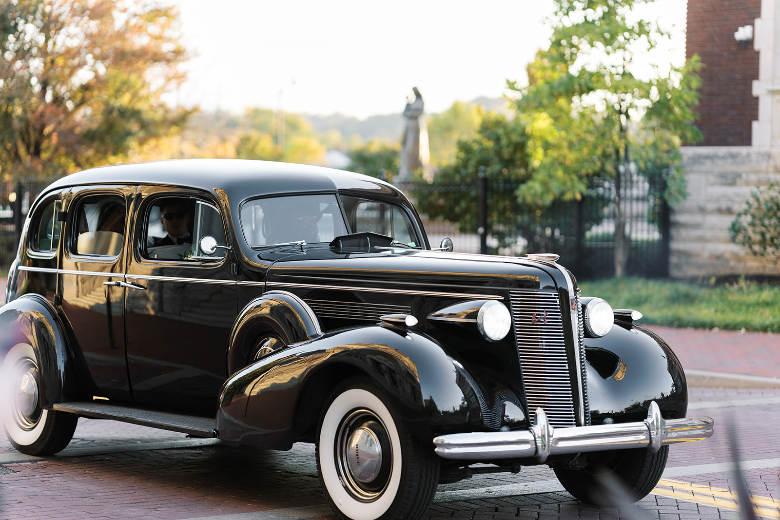 Vintage black wedding car on a Cincinnati street after Dom and Hayley's ceremony