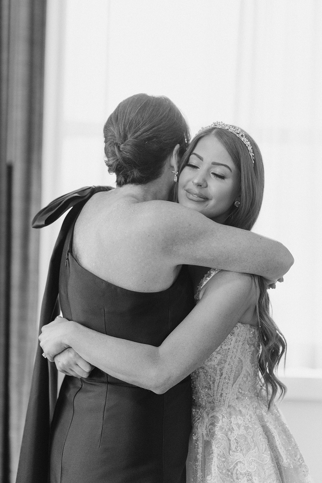 An emotional black-and-white embrace during Hayley's wedding morning
