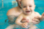 Swimming lesson for young children Swimming in the children's pool Swimming instructor and