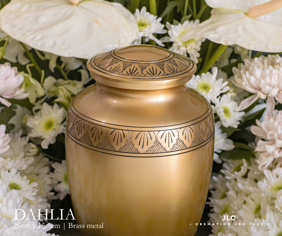 Premium gold cremation urn with hand-carved detailing for adult ash remains.