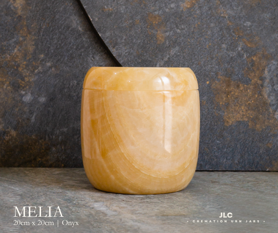 Premium gold onyx cremation urn with natural stone finish for adults.