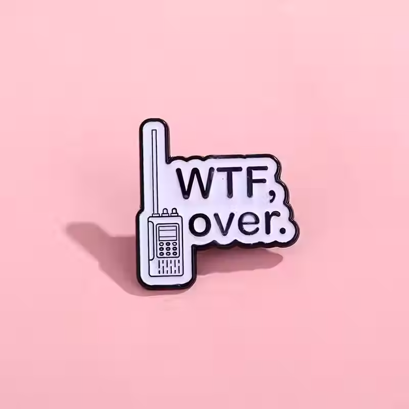 WTF Enamel Pin on pink background