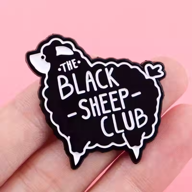 hand holding The Black Sheep Club Enamel Pin
