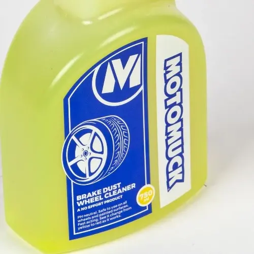 Close-up of Motomuck Wheelmuck+ 750ml brake dust wheel cleaner showing the blue product label on the yellow bottle