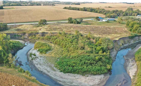Aerial view of the untouched natural landscape surrounding the Little Nemaha River, showcasing the beauty of the area before the establishment of Little River's Edge RV Park and Campground.