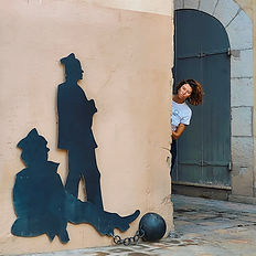 Sculpture of historic prisoners in Toulon city center, featured during a local guided tour.
