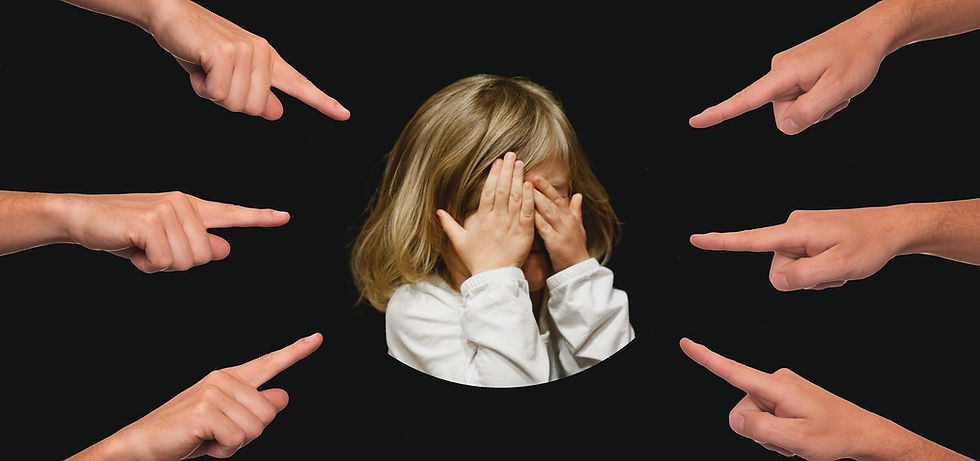 Six fingers pointing at a girl who buried her face in her hands