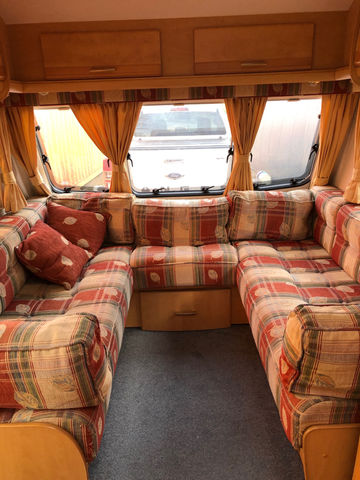 Comfortable lounge area in caravan from Cosy Caravan Hire Bay of Plenty