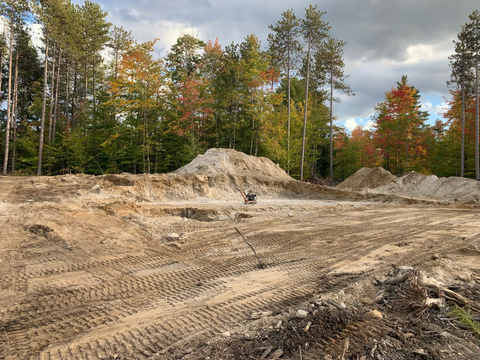 Land that has just been cleared and graded by an excavator