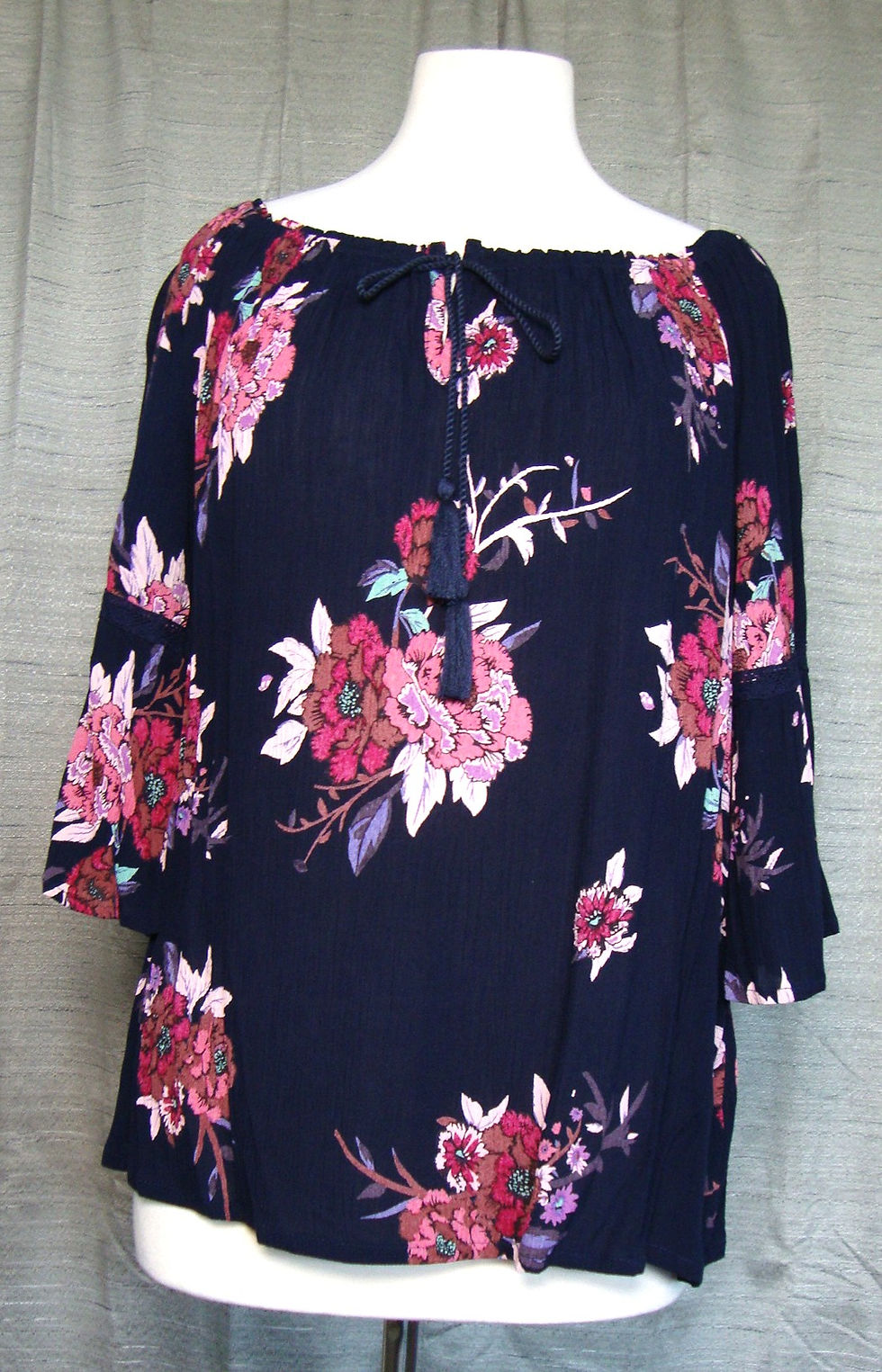 Bila PL navy and pink floral crinkle blouse on a mannequin