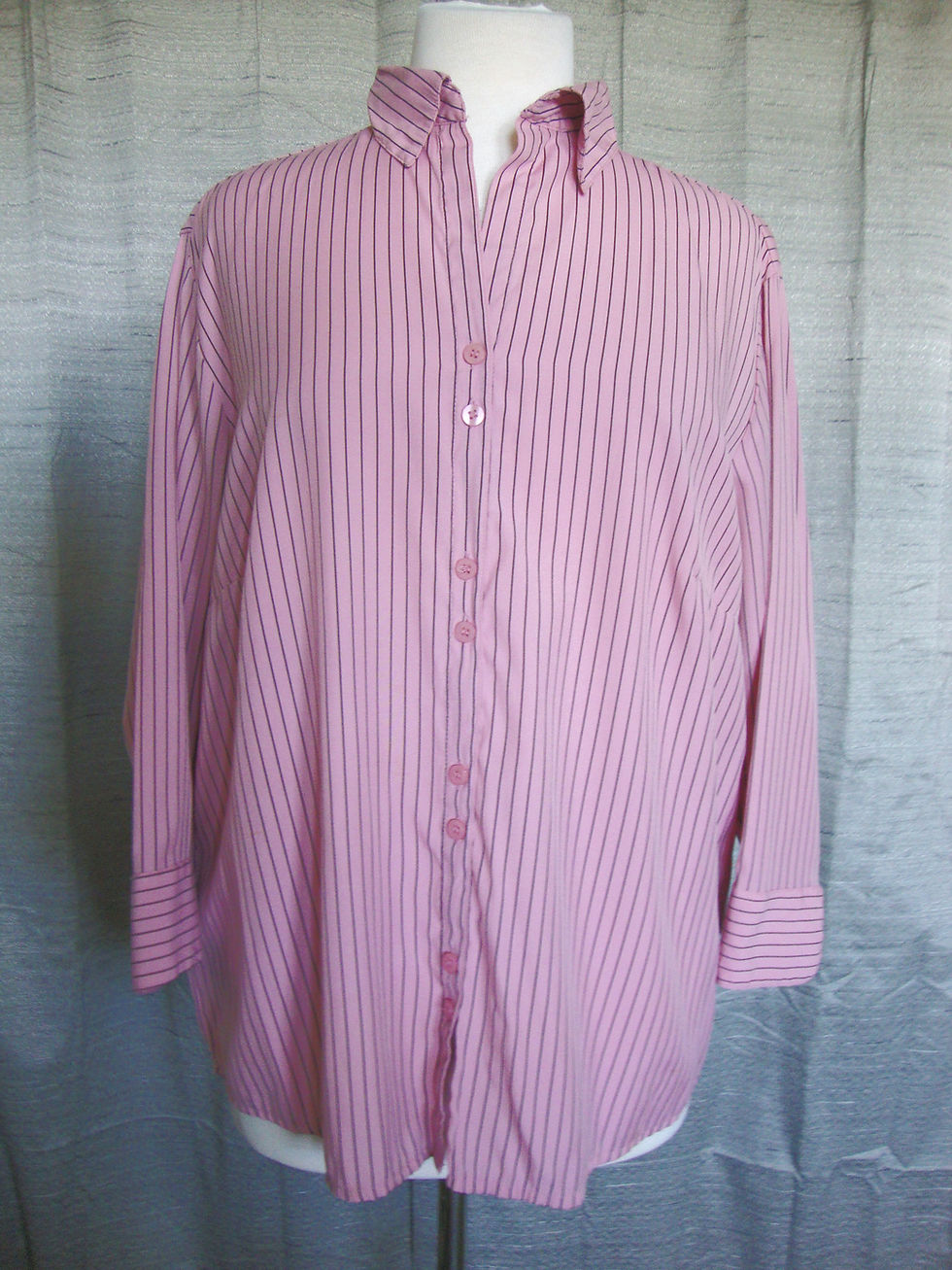 Dressbarn pink striped button-front blouse on a mannequin.