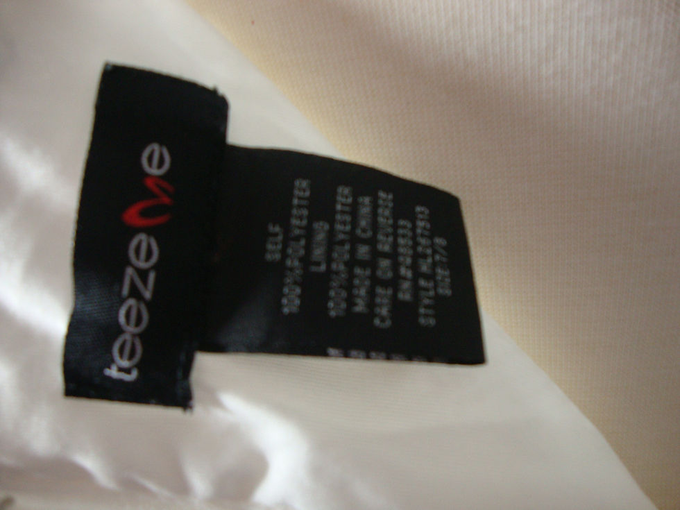 Thumbnail: Teeze Me dress tag showing size 7/8 and polyester material.