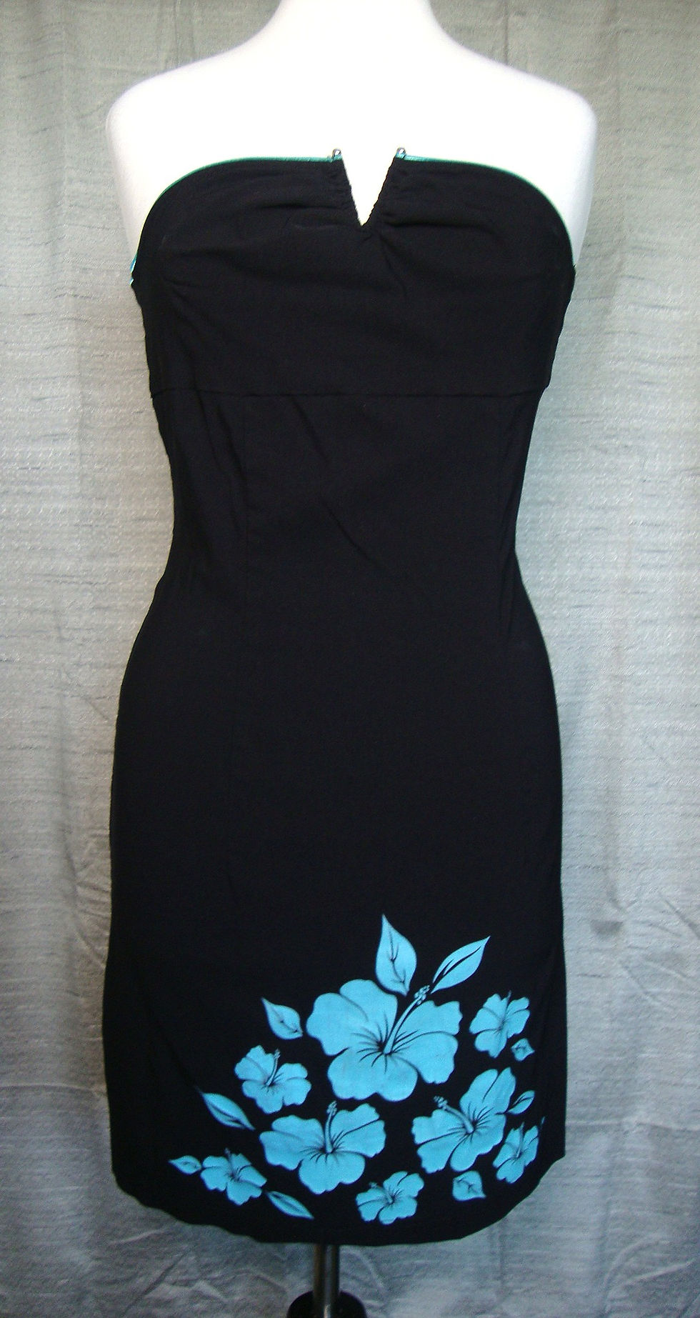 Black strapless Wrapper Sugar floral dress on a mannequin.