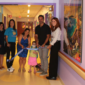 Representatives from SAHF, SAH, Tim Horton's and Smilezone cut a ribbon