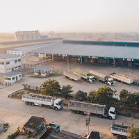 aerial-view-factory-trucks-parked-near-w