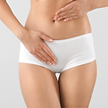 woman in underwear with hand over vulva