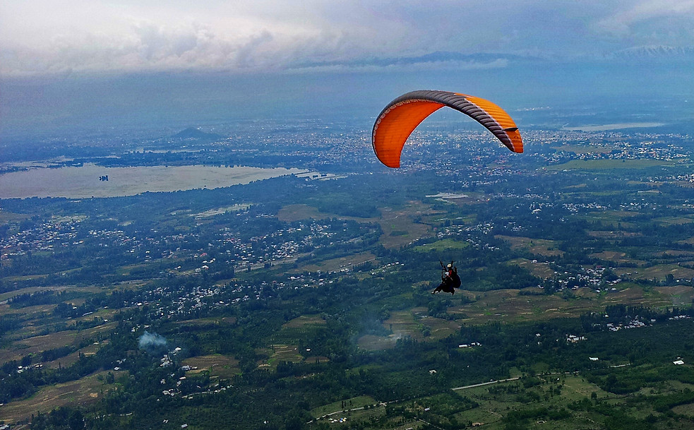 A Paraglider flying over Kashmir Valley