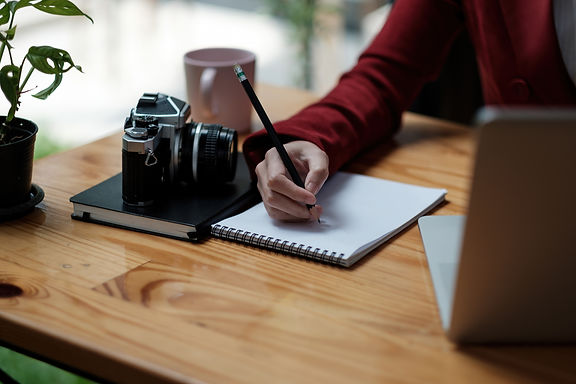 close-up-hand-of-girl-writing-some-data-in-noteboo-2023-11-27-05-28-25-utc.jpg