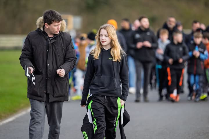 Cora Moore talking strategy on a track walk for Club100 with her father, Dan. (March 2025) ©John Patterson Photography
