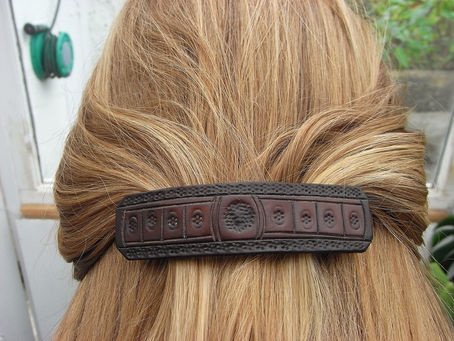 Tooled leather hairslide. I.W.