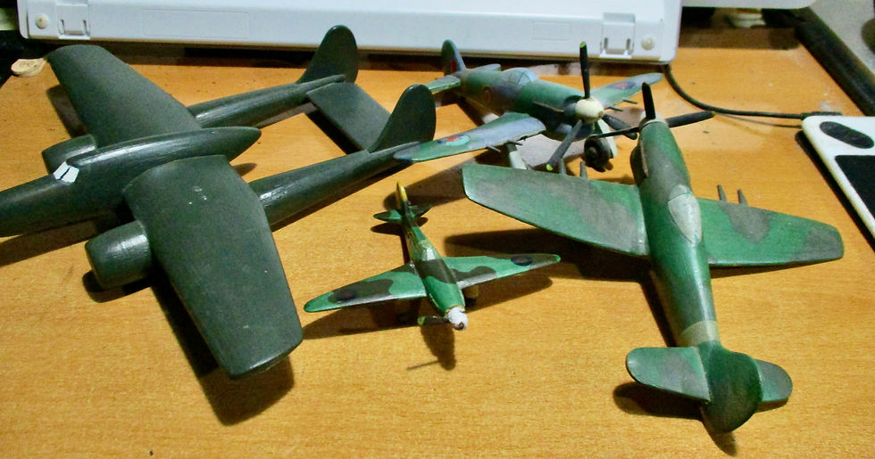 WW2 planes, wooden and painted. My Dad made these in the fire service.