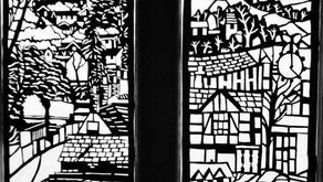 The finished cut card window scenes mounted on the glass door panels.