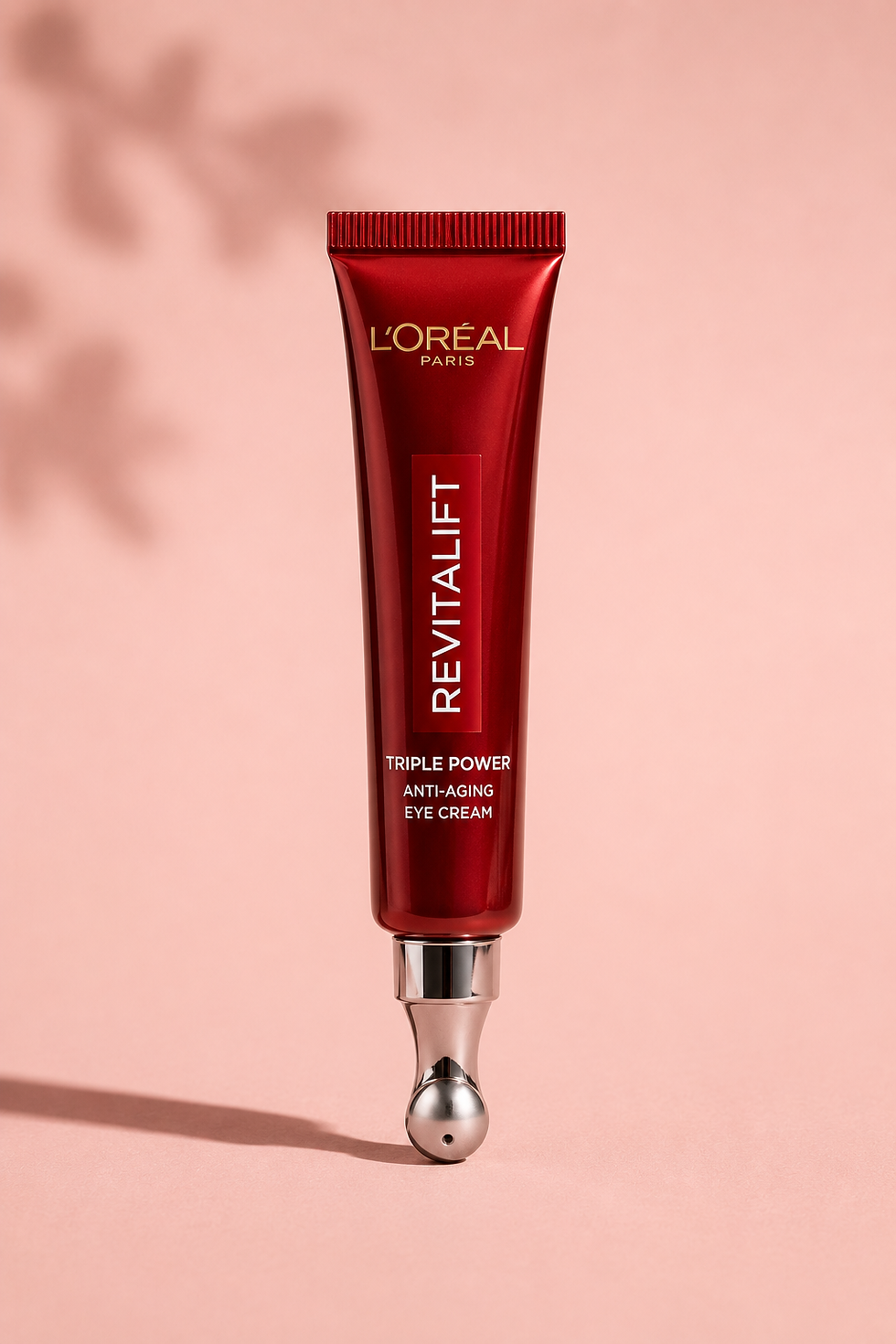 L'Oreal Revitalift Triple Power Eye Cream tube on marble surface