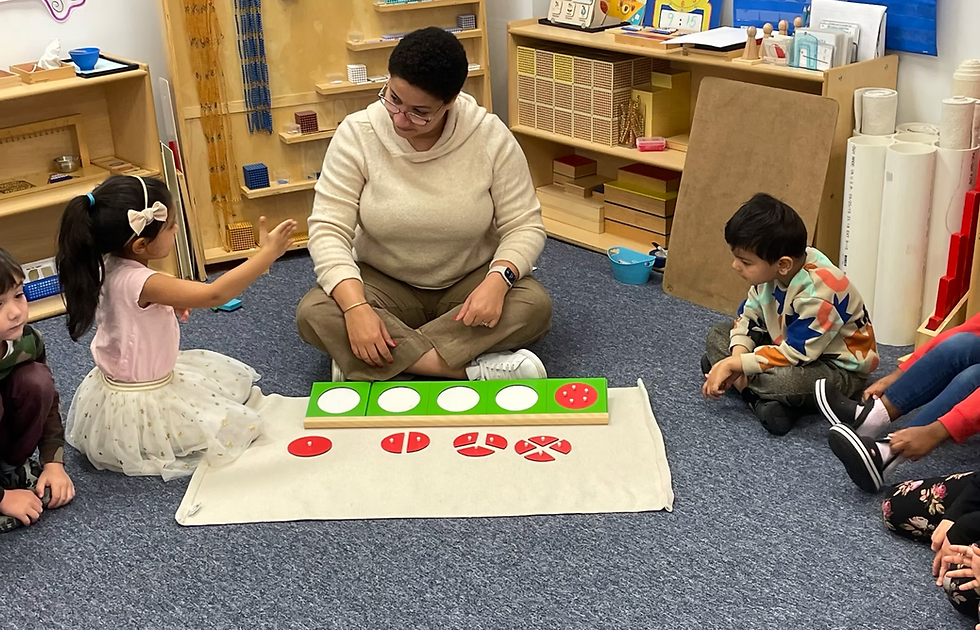 Montessori teacher introduces metal fraction insets as students explore how a whole can be divided into equal parts.