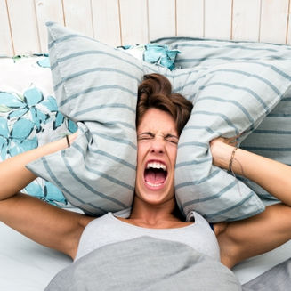 Midlife women laying awake struggling to sleep