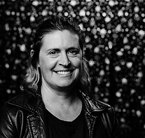 A black and white picture of Harriet in front of a sparkling backdrop