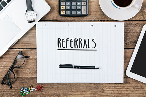 word referrals on notebook, Office desk