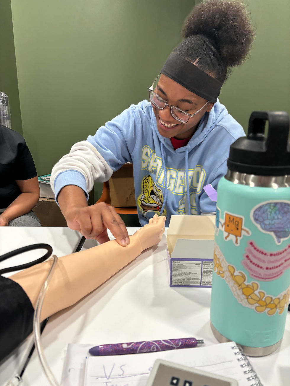Week 1-Vanessa checking bp and smiling