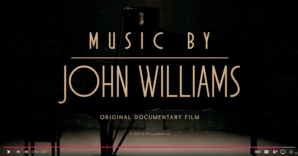 Film poster, "music by John Williams" superimposed over a grand concert piano