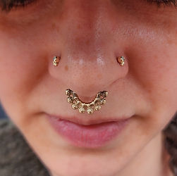 Beautiful Paired Nostril Piercings with Yellow Gold from Alchemy Adornment