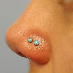 Double Nostril Piercing Performed in 2018 with Neometal Turquoise Cabs