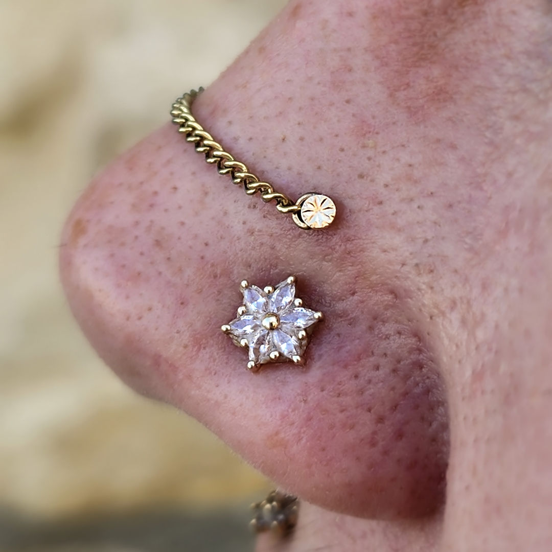 High Nostril Piercing with Gold Laser Disk