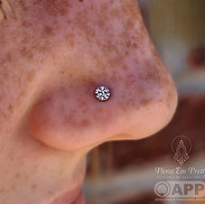 White Gold Hammered Disk in Nostril Piercing