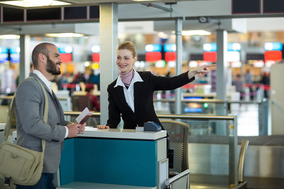 airline-check-attendant-showing-direction-commuter-check-counter.jpg