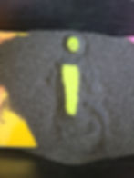 writing letters in black sand