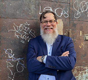 BrianDAvery StandingatDoor wJacket (Medium).png