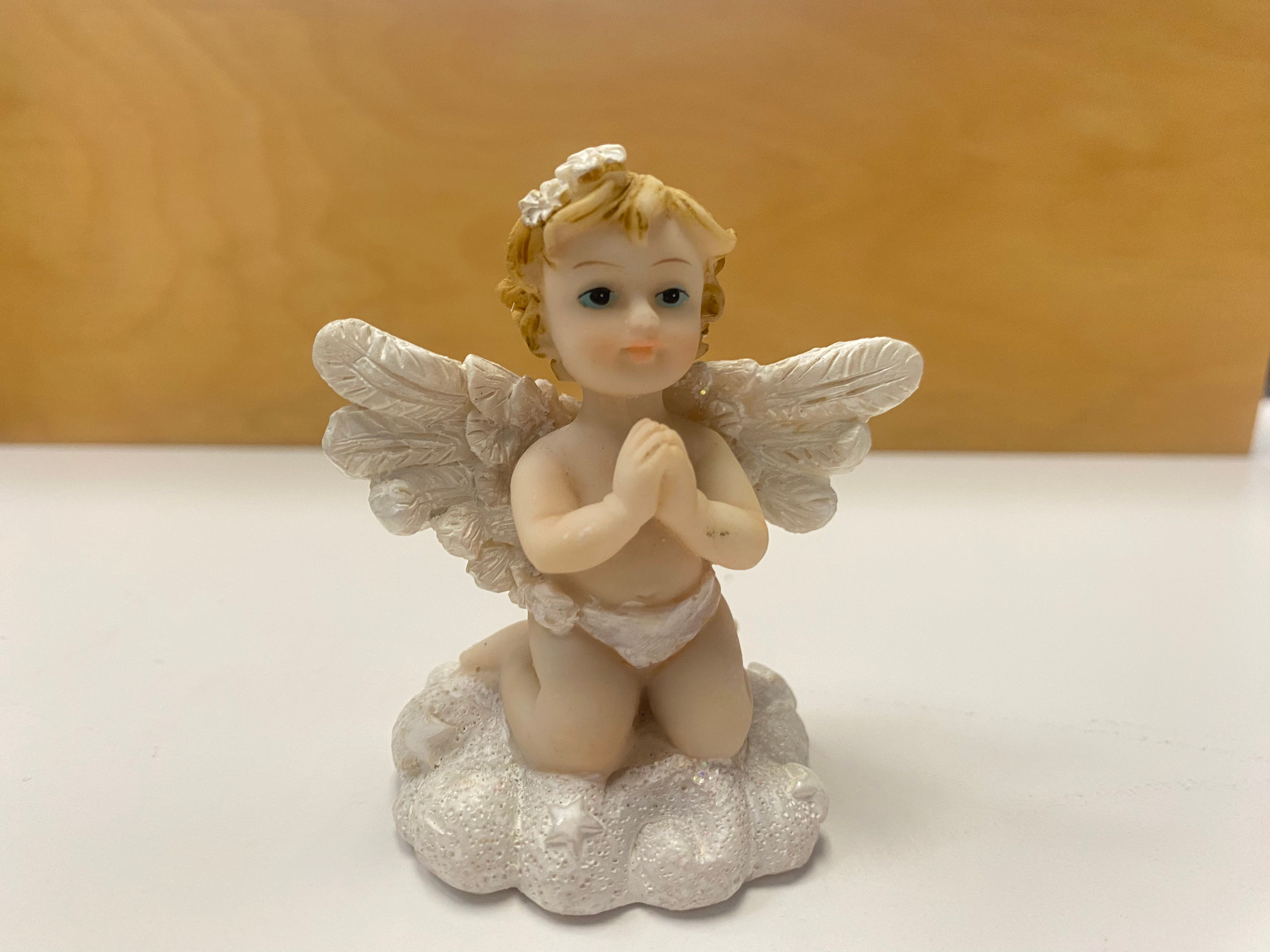 Small baby Angel praying