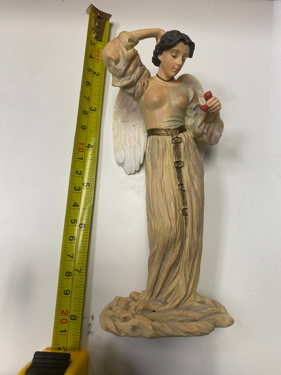 Lady priest Angel holding roses