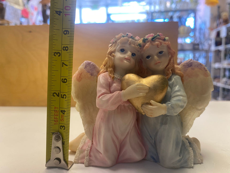 Two Angeles holding one heart